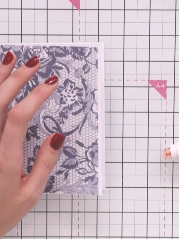 Step 2: Wrap the decorative vellum piece around the front of the card base. Secure it at the back with tape to hold it