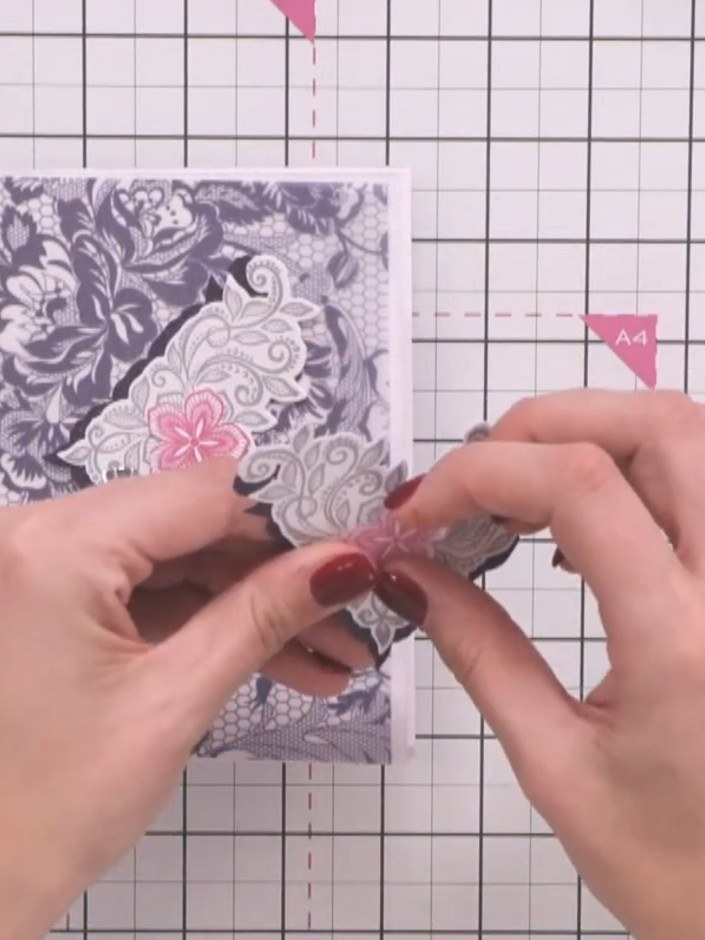 Step 3: Stamp the corner design twice in grey ink onto white cardstock. The design features an ornate floral corner mo