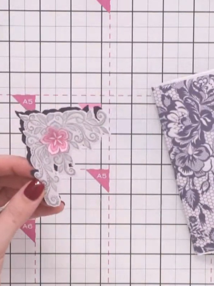 Step 4: Cut out the corner design using the outline die to create a second layer. Position the decorative lace corners