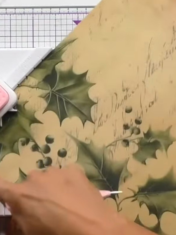 Step 2: Score down and across the decorative paper using the box making board's scoring guides. Rotate the paper and r