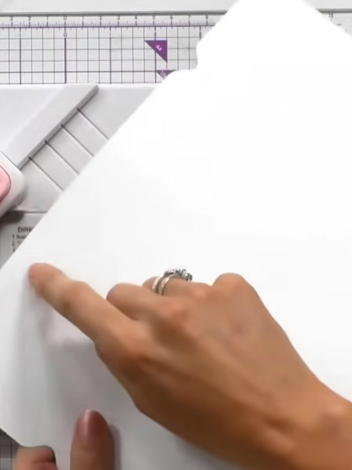 Step 4: Turn the white card over so the punch lines are visible. Carefully remove the small triangular pieces that hav