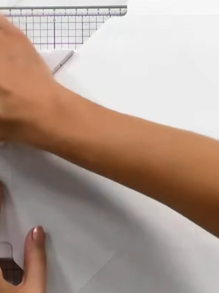 Step 5: Fold up all four sides of the white box making board to create the box walls, allowing them to naturally come 