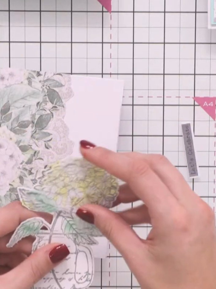 Step 2: Layer decorative die-cut floral elements together to create dimensional embellishments for your card.