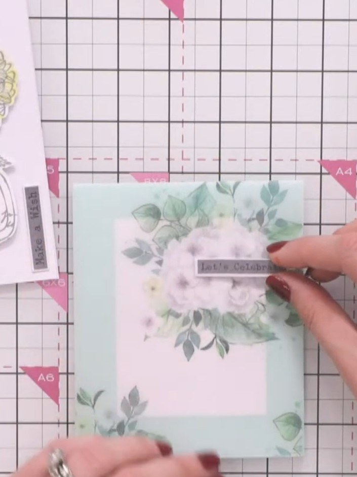 Step 2: Position a white panel behind the vellum card front so it shows through, creating a backing that makes the flo