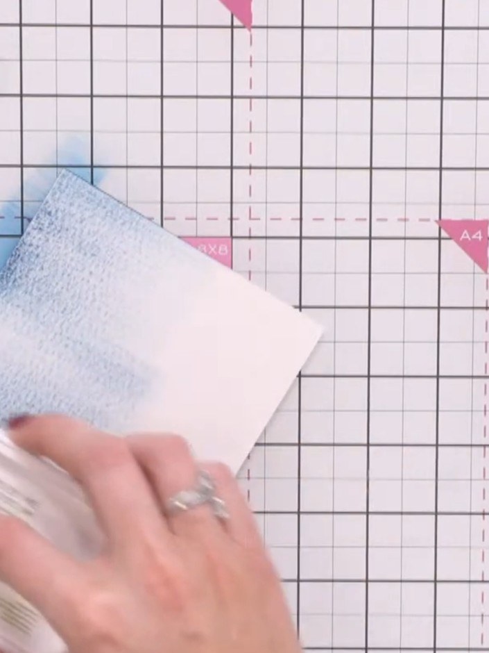 Step 1: Swipe the Tiffany blue ink pad down the left side of your white card base. Continue building up colour layers 