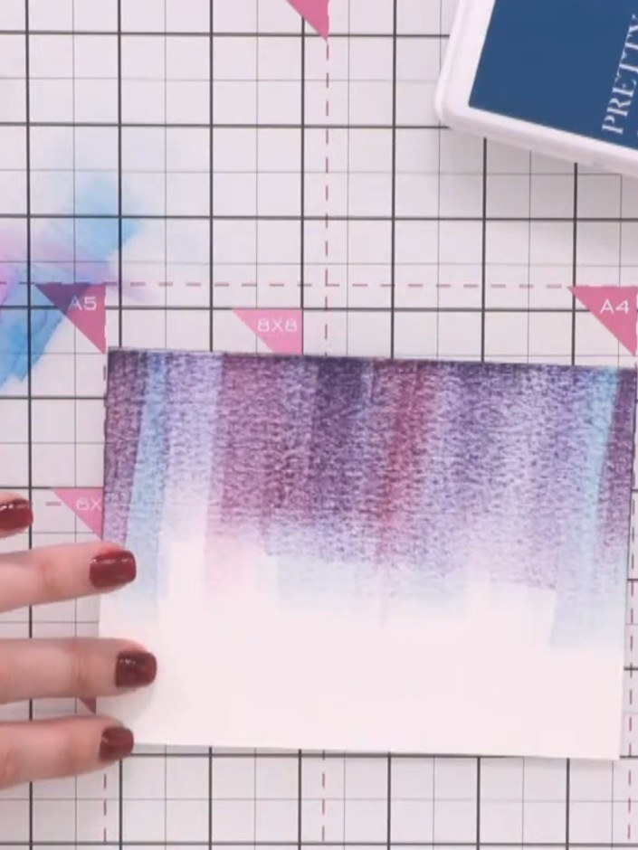 Step 4: Continue spraying with Pacific ink and tapping the card until you achieve the desired colour saturation and bl