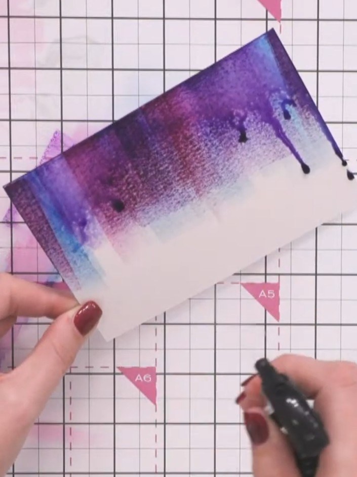Step 5: Use a heat gun to heat set the watercoloured background panel until completely dry. Move the heat gun continuo