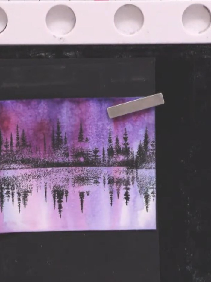 Step 9: Stamp the foliage leaves in black ink at the base and sides of the stamped image to create foreground interest