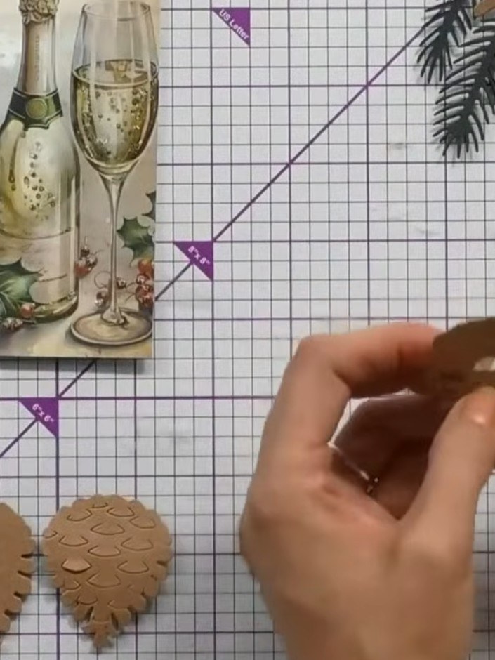 Step 1: Cut out the pine cone shapes using the Perfect Pinecones die set. The die cuts will produce multiple layered p
