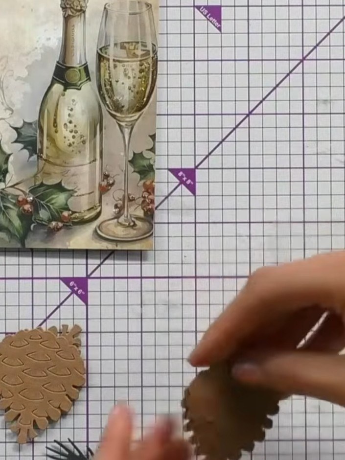 Step 6: Cut the outer 'jacket' layer from darker brown cardstock. Glue this layer on top of the pine cone base to add 