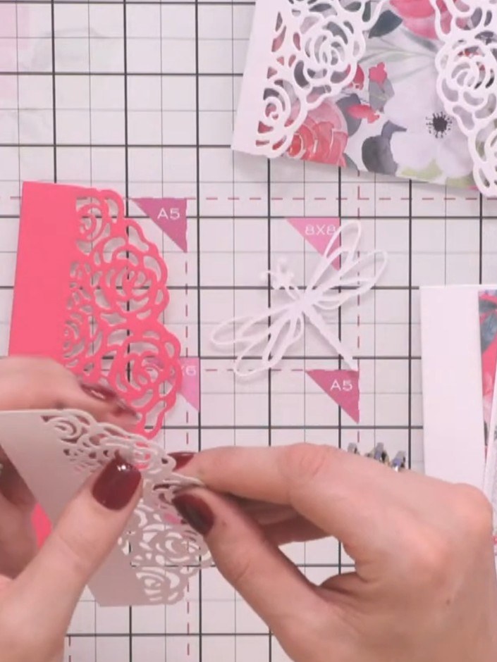 Step 3: Layer the dragonfly pieces by stacking different coloured papers together. Use teal, white, pink, and patterne