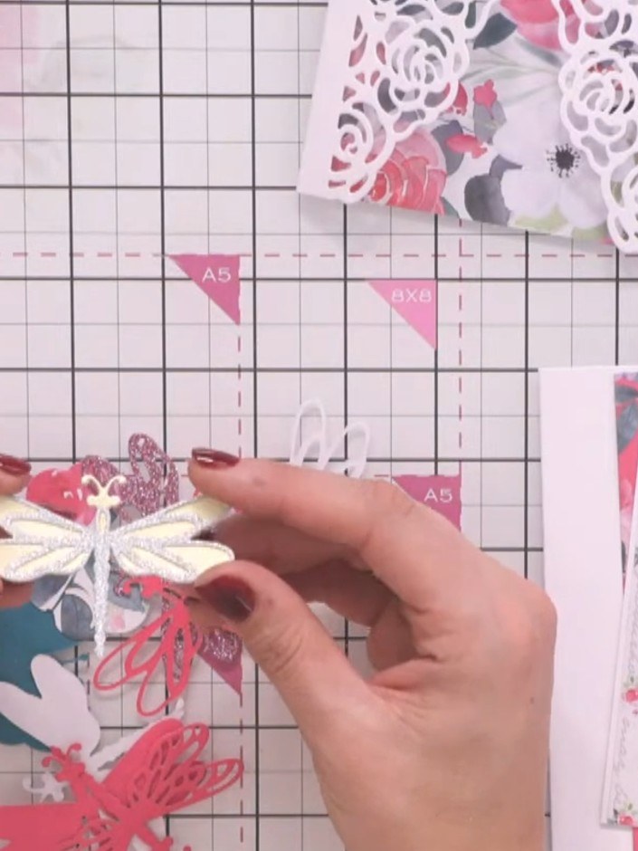 Step 4: Adhere the layered dragonfly embellishment to the front of your wrap card. Position it centrally over the deco