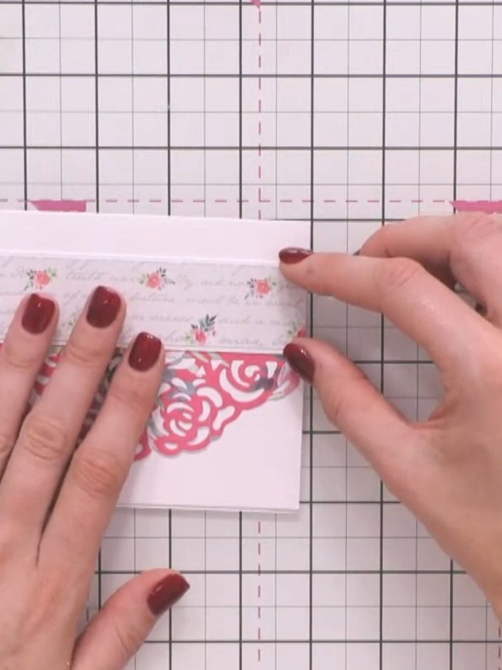Step 3: Position the floral patterned banner strip horizontally across the centre of your card base to split up the pi