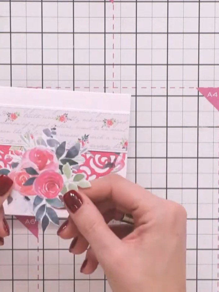 Step 4: Fussy cut a flower motif from the patterned paper. Carefully cut around the outline of the flowers to create a