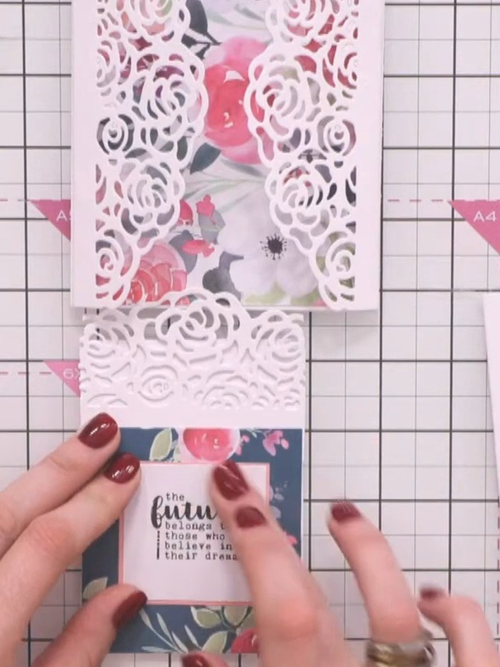 Step 4: Glue the bookmark strip to the back of the wrap panel with the navy floral pattern. Trim any excess from the b