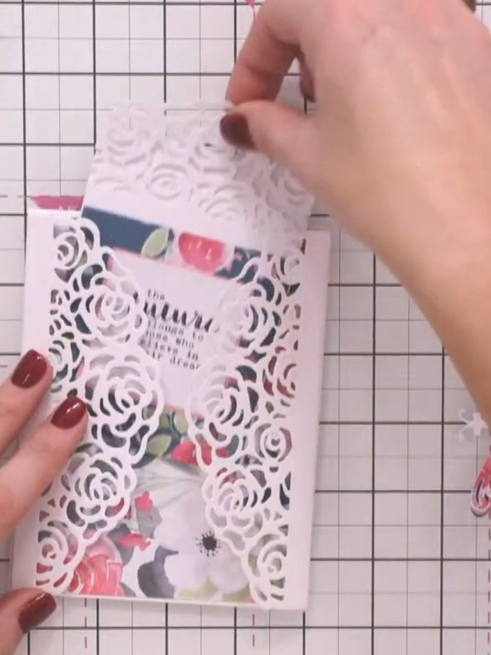 Step 6: Position the decorative wrap element on the front of your card, ensuring the bookmark is visible through the c