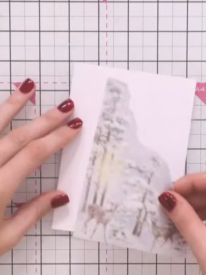 Step 1: Take a piece of vellum from the Winter Story collection offcuts and tear it by hand to create a hill shape alo