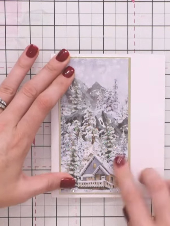 Step 3: Add sparkle or embellishment to the tree designs on the patterned panel to create a snowy effect. Use glitter,