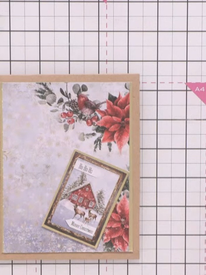 Step 5: Cut out a poinsettia flower cluster from the Winter Story paper collection. Position it in the lower right cor