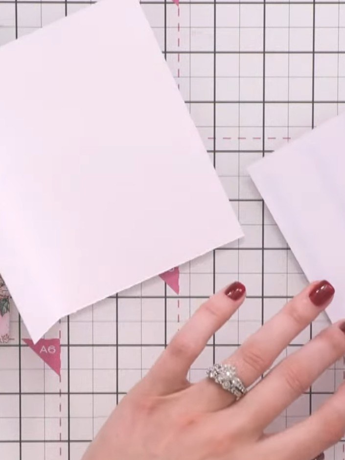 Step 3: Corta un segundo panel del papel decorado rosa floreado para usarlo como capa de fondo en el frente de tu tarjeta.