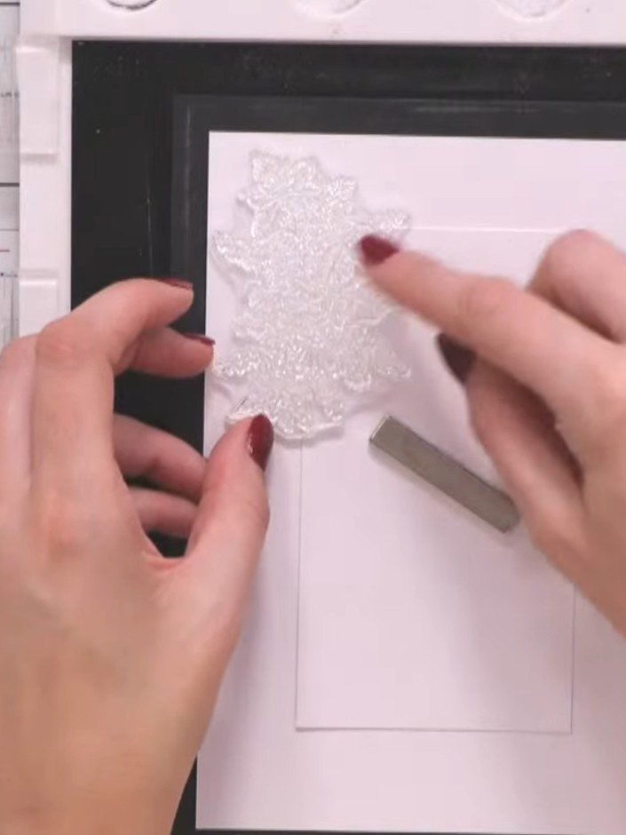 Step 4: Ink up the poinsettia floral stamp from the Winter Story collection using black ink. Position the stamp ready 