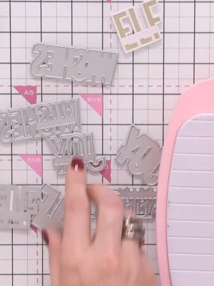 Step 2: Place the exterior die onto your pink cardstock and run it through your die-cutting machine to cut out the out