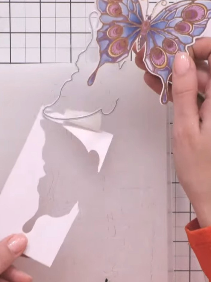 Step 10: Position the butterfly wing dies slightly apart on your card to create a half-wing effect, allowing the butter