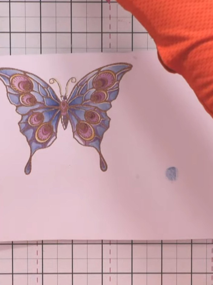 Step 9: Place your butterfly card into the 3D embossing folder, ensuring the front is facing the correct way. Run the 