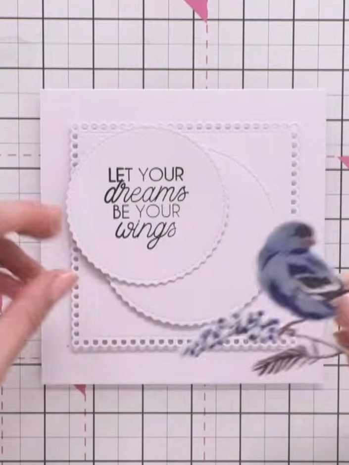 Step 11: Mount the layered bird design onto the sentiment card using foam pads for dimension. Position the bird and fea