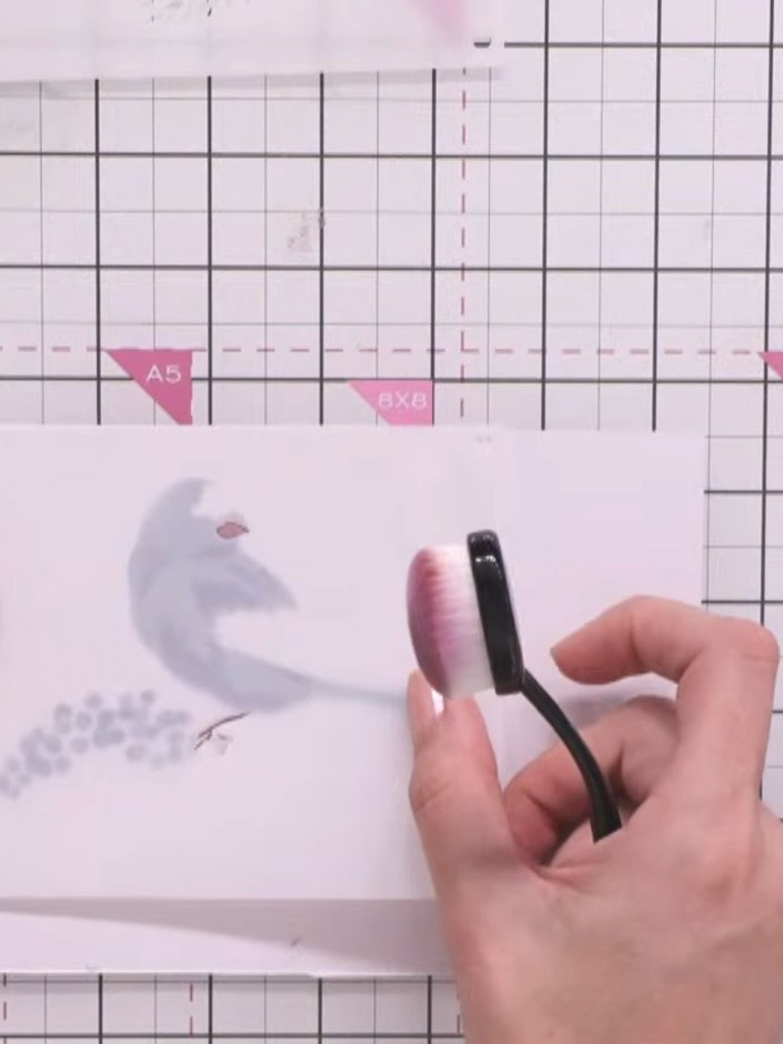 Step 7: Apply the fourth stencil layer using the same light colour ink to add dimension to the beak and foot details o