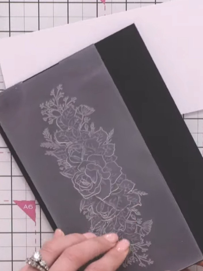 Step 2: Tap the inked pad onto the top of the embossing folder design to apply concentrated colour to the raised areas