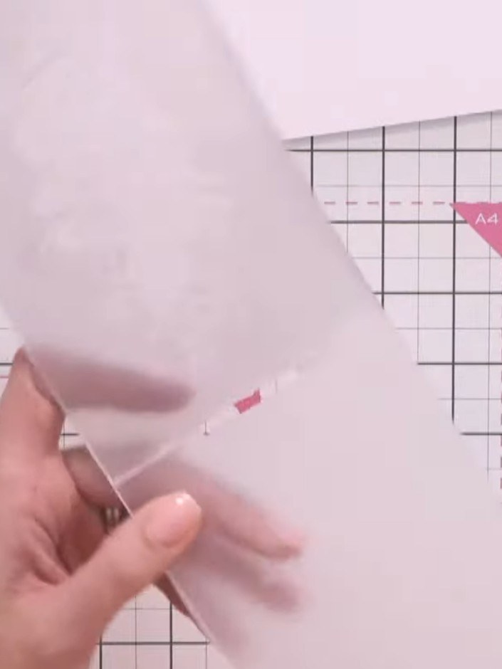 Step 3: Lightly spray the inked embossing folder with water using a spray bottle to create texture and achieve a vinta