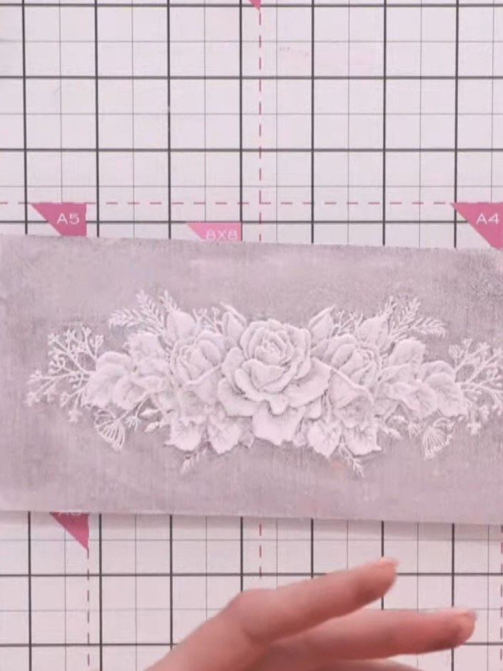 Step 5: Once the embossed card is dry, use a dry brush technique to add subtle colour accents. Brush a small amount of
