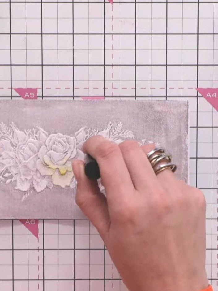 Step 6: Add touches of yellow ink to selected areas of the botanical design using a dry brush method, keeping the colo