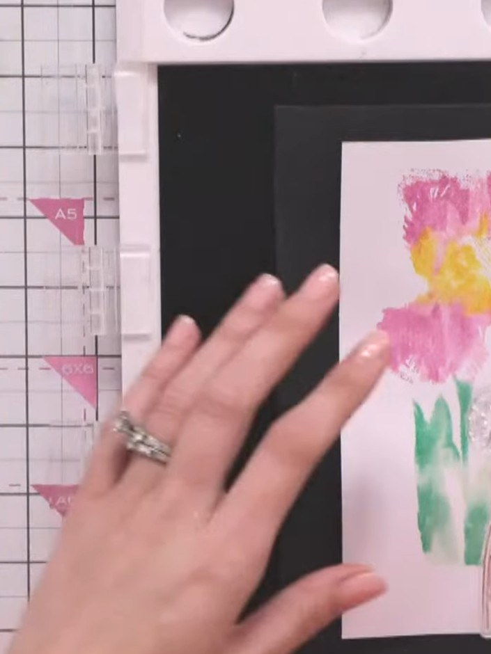 Step 11: Position the iris outline stamp over your watercoloured image and stamp firmly to add definition and detail to