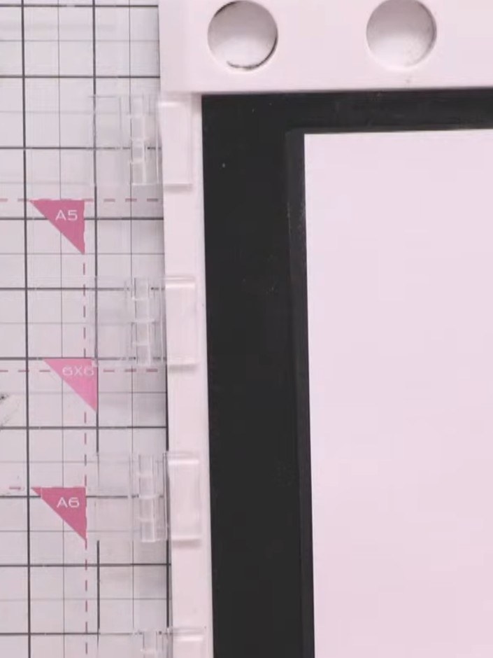 Step 1: Cut a piece of pink card stock and trim it to size for your hot air balloon design. Place the card on your cra