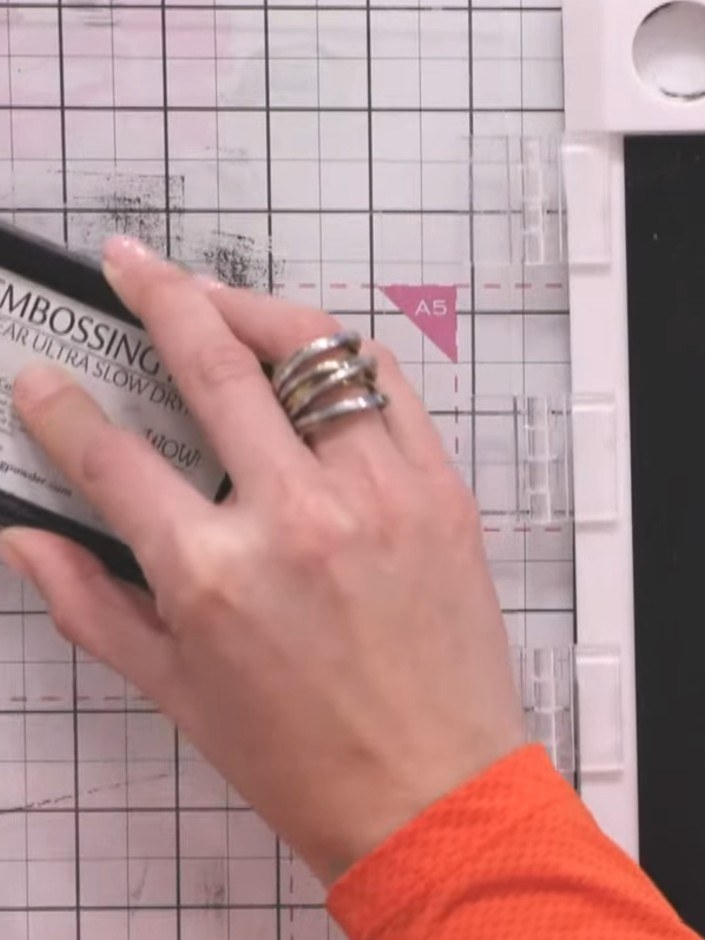 Step 5: Immediately sprinkle gold embossing powder over the wet stamped ink, ensuring all the stamped areas are comple
