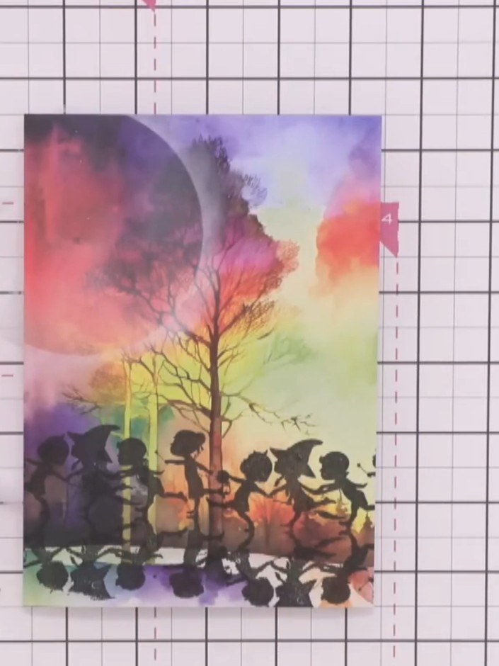 Step 9: Using a white gel pen, add highlights to the tops of the silhouettes' heads, arms and shoes to catch the moonl