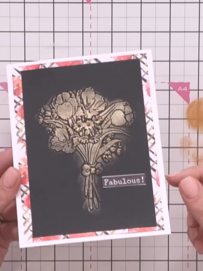 Step 6: Hold the embossed black card panel up to the light to showcase the depth and dimension created by the layered 