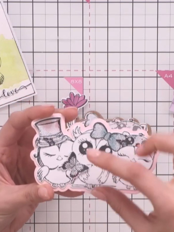 Step 7: Stamp your chosen sentiment word (such as 'Joy') onto a small die-cut piece. Use the stamps from the Owl Alway
