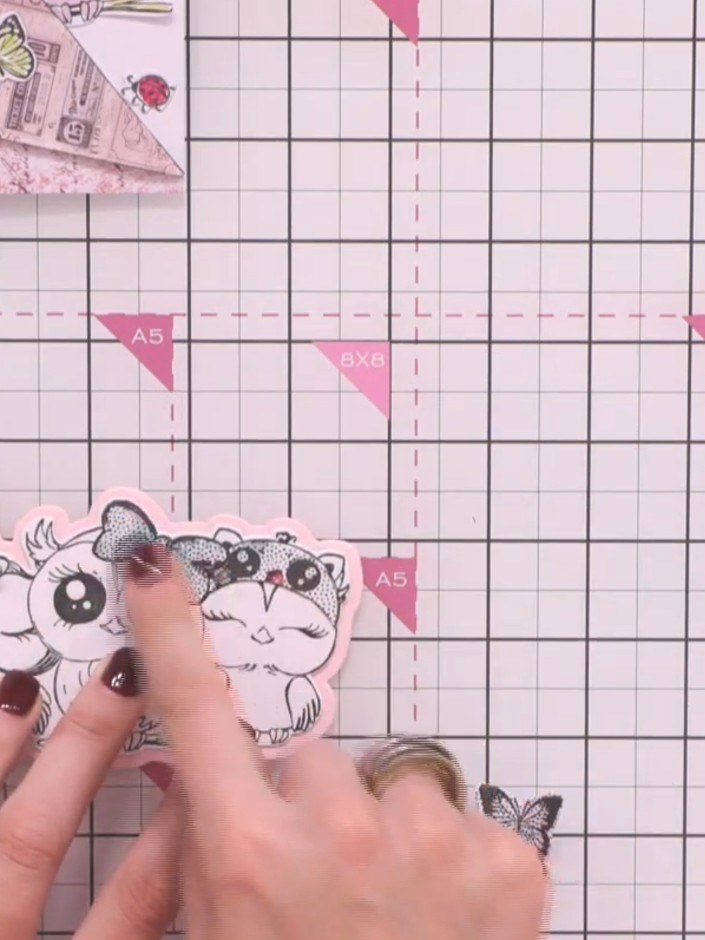 Step 8: Glue the patterned paper bow and head piece onto the corresponding owl to add decorative detail. Position them