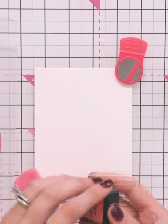 Step 3: Ink up the centre of the poppy stamp with your first Distress Ink colour. Then spot additional colours around 