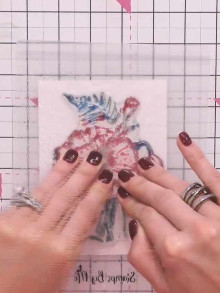 Step 6: Press the stamp firmly onto the watercolour cardstock and hold it in place for a few seconds to allow the ink 