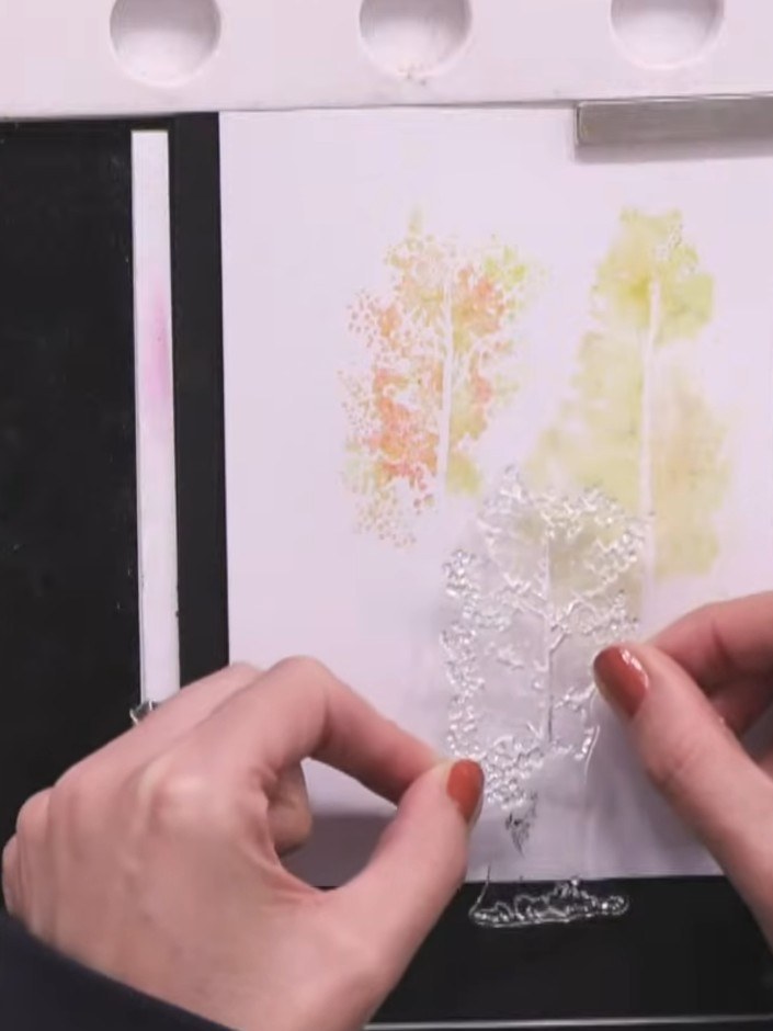 Step 4: Stamp the inked trees onto the smaller white card blank. Position the trees at different heights to create vis