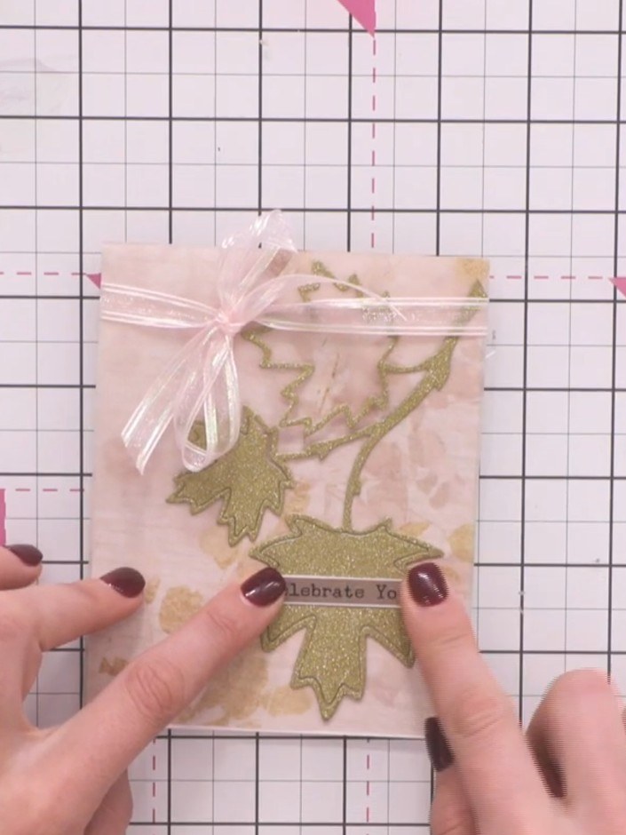 Step 9: Add a sentiment stamp such as 'Celebrate You' to the centre of the card to complete your design. The finished 