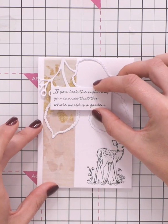 Step 8: Stamp a positive sentiment such as 'If you look the right way you can see that the whole world is a garden' on