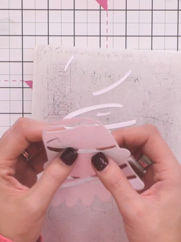 Step 5: Carefully pop out all the small die-cut embellishments from the backing sheet. Take care not to tear or damage