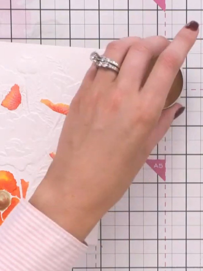Step 10: Apply gold gilding wax over the dried watercoloured poppy design by gently tapping and rubbing with your finge