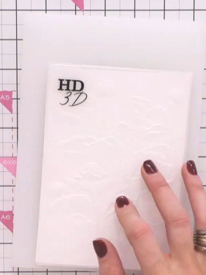 Step 3: Run the white cardstock through your die-cutting machine using the white plate, the poppy embossing folder, an