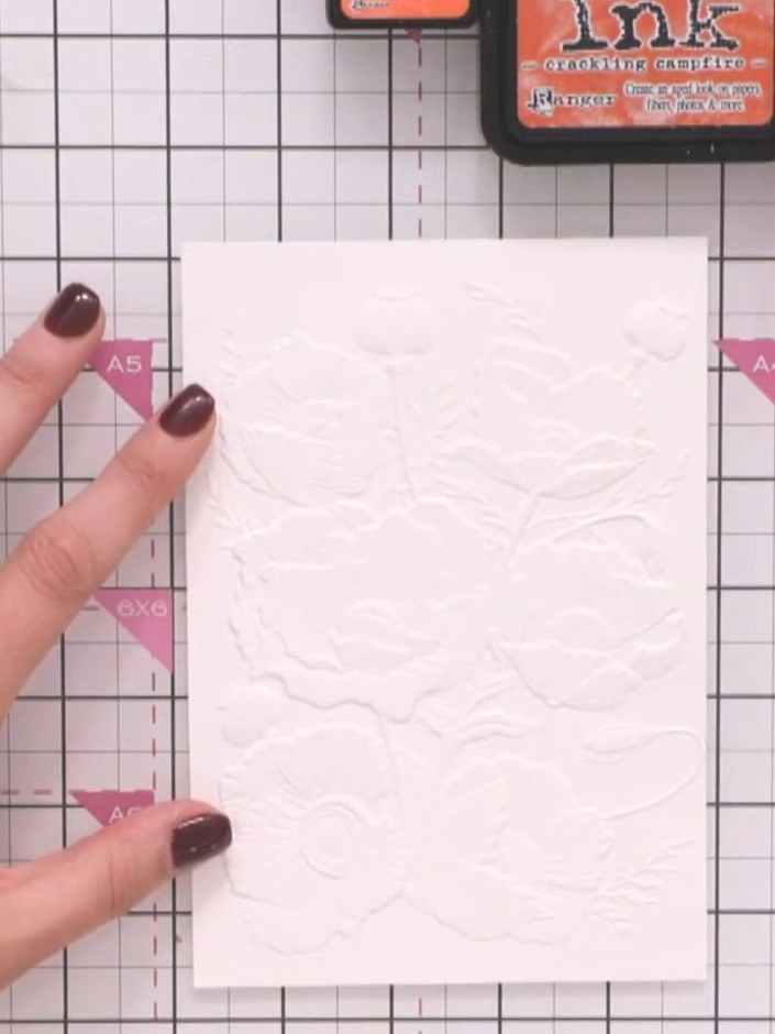 Step 5: Pick up colour from your orange ink pad with a wet brush or watercolour pen and spot it into the wet petal are